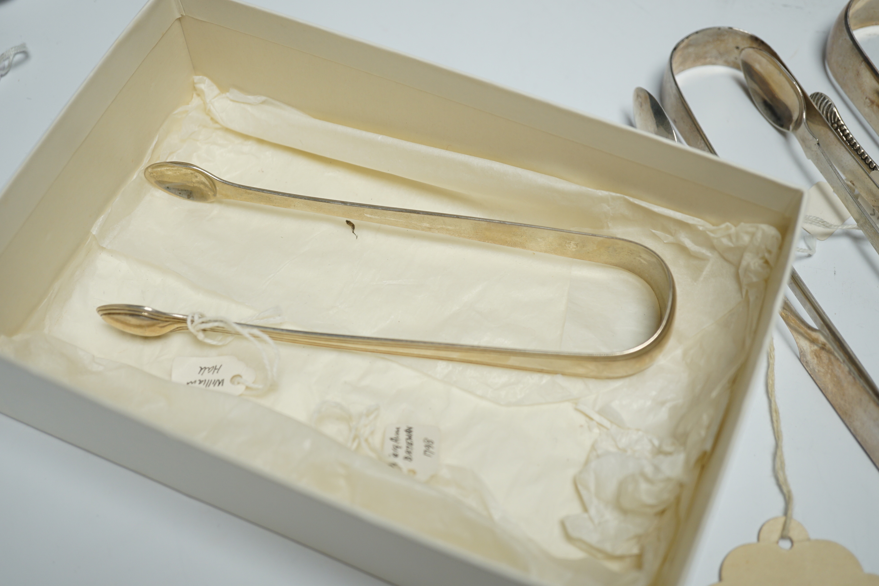 Eight assorted pairs of 18th and 19th century silver sugar tongs including Peter & Ann Bateman.